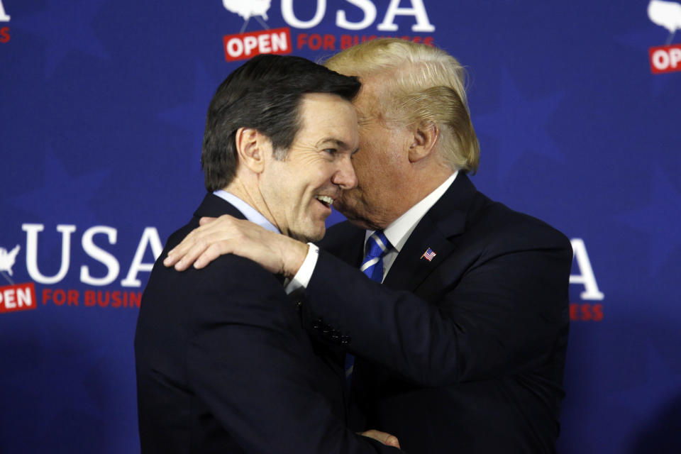 President Trump, right, greets Rep. Evan Jenkins, R-W.Va., at a roundtable discussion on tax reform in White Sulphur Springs, W.Va. on April 5. (Photo: Luke Sharrett/Bloomberg via Getty Images)