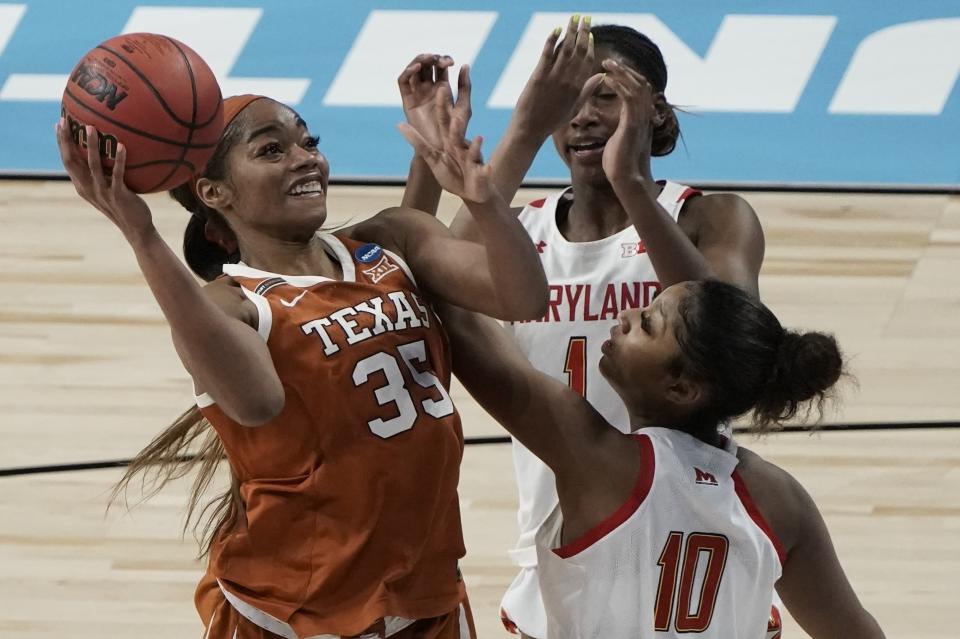 Texas's Charli Collier shoots over Maryland's Angel Reese during the second half of an NCAA college basketball game in the Sweet 16 round of the Women's NCAA tournament Sunday, March 28, 2021, at the Alamodome in San Antonio. (AP Photo/Morry Gash)