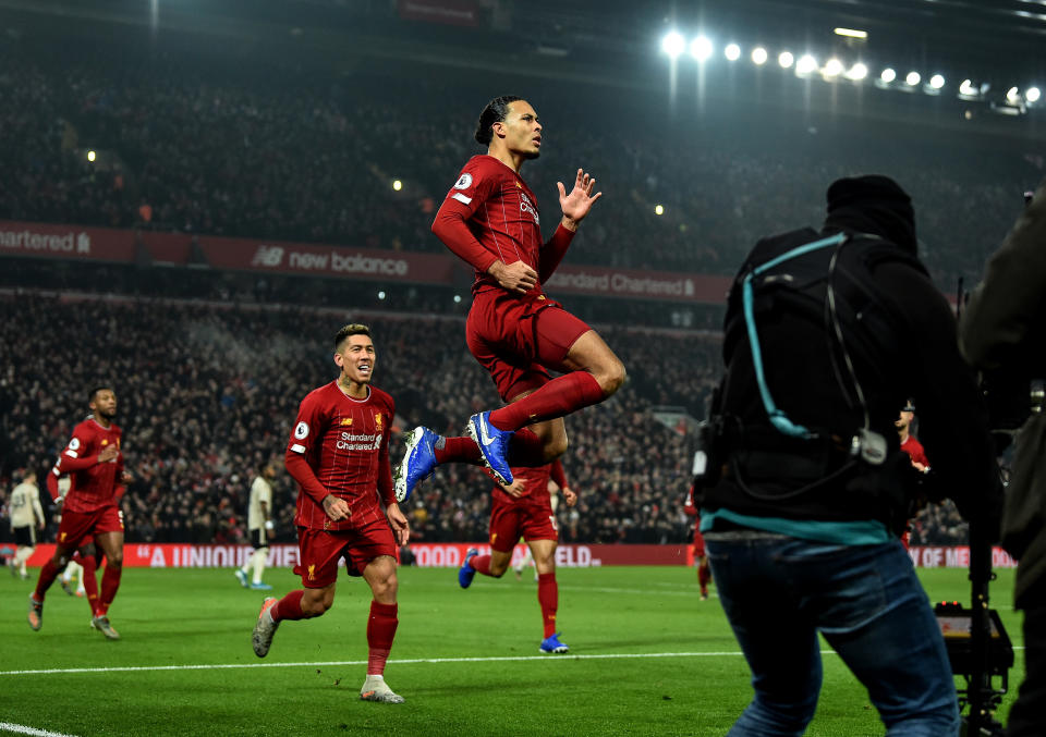 Virgil van Dijk (right) gave Liverpool an early lead on Sunday against Manchester United. (Photo by Andrew Powell/Liverpool FC via Getty Images)