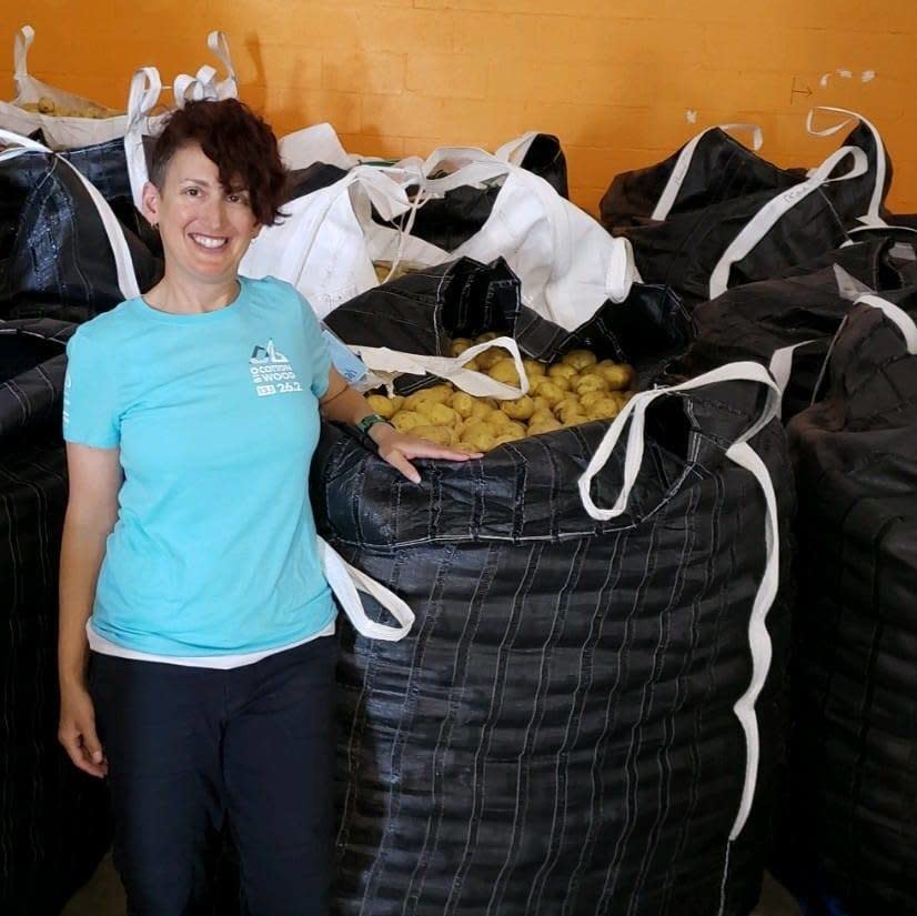 The author at Feeding Palm Beach County. The food bank had just received a massive donation of potatoes to be sorted and packaged by volunteers into family-friendly bags. (Photo: Jess Kurti)