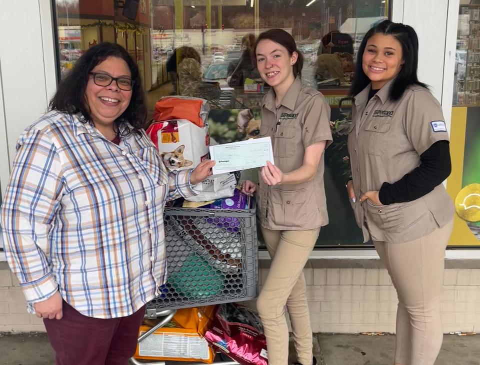 Petland Ashland employees present supplies and $500 from Petland Charities to Catherine Delvalle with Cabin Critters Rescue of Wheelersburg, OH.  Courtesy: Petland, Inc.