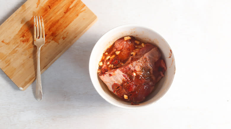 marinated beef in white bowl