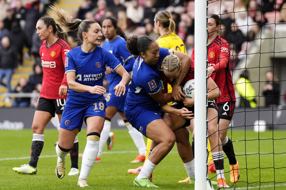 Tempers flare between Chelsea's Lauren James, centre, and Manchester United's Millie Turner, second right, after Lauren James scores their side's first goal during the Adobe Women's FA Cup semi-final match between Machester United and Chelsea in Leigh, England, Sunday, April 14, 2024. (Nick Potts/PA via AP)