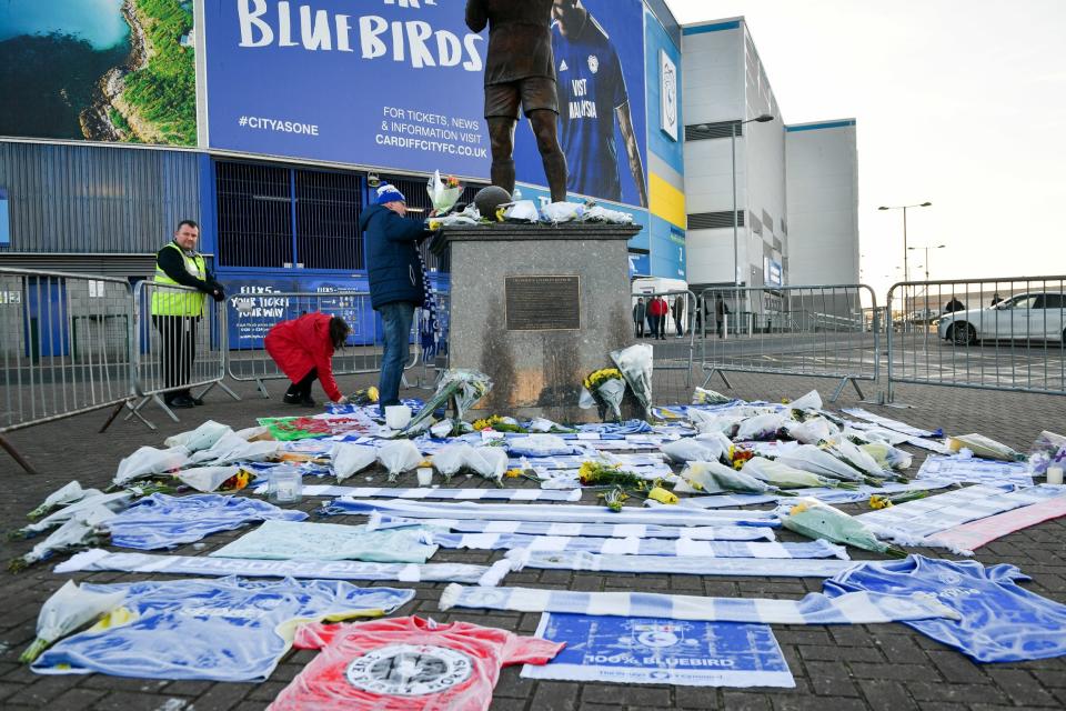 Flowers and tributes have been left outside Cardiff City Stadium (PA)