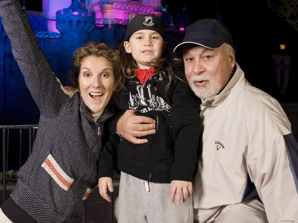 Celine Dion, son Rene-Charles, 6, and husband Rene Angeli outside Sleeping Beauty Castle at Disneyland in Anaheim, Calif. on Wednesday night