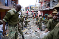 <p>Rescue workers search for residents feared trapped in the rubble of a six-story building that collapsed after days of heavy rain, in Nairobi, Kenya, April 30, 2016. <i>(Photo: Harman Kariuki/Reuters)</i></p>