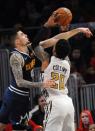 Dec 8, 2018; Atlanta, GA, USA; Atlanta Hawks forward John Collins (20) grabs a rebound away from Denver Nuggets forward Juan Hernangomez (41) during the second half at State Farm Arena. Christopher Hanewinckel-USA TODAY Sports