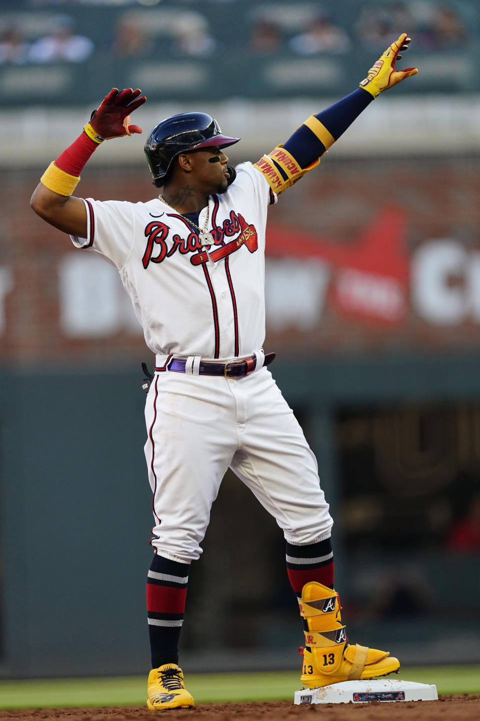 Atlanta Braves right fielder Ronald Acuna Jr., strikes a pose as he stands on second base after hitting a double in the first inning of a baseball game against the Boston Red Sox Wednesday, June 16, 2021, in Atlanta. (AP Photo/John Bazemore)