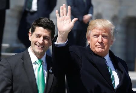 U.S. President Donald Trump waves with Speaker of the House Paul Ryan (R-WI) after attending a Friends of Ireland reception on Capitol Hill in Washington, U.S., March 16, 2017. REUTERS/Joshua Roberts