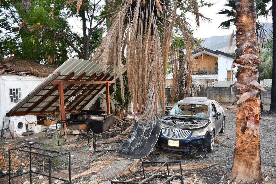 A home and car damaged by a Hezbollah attack on Kiryat Shmona. (Photo by Charlotte Lawson)