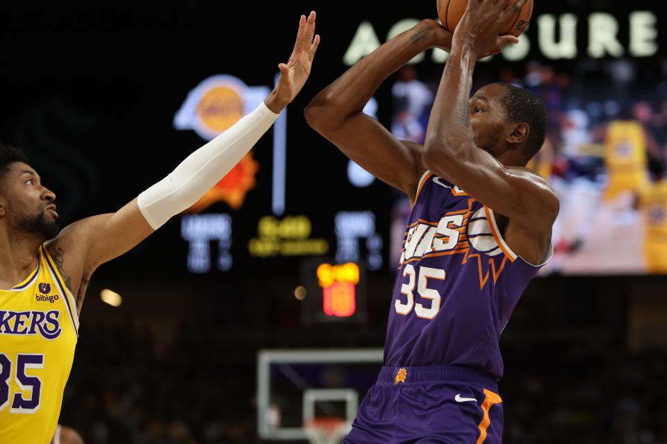 Phoenix Suns forward Kevin Durant (35) shoots the ball over Los Angeles Lakers forward Christian Wood (35) during the first quarter at Acrisure Arena in Palm Desert, Calif. on Oct. 19, 2023.