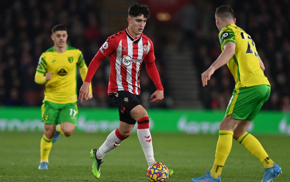 Southampton's Tino Livramento runs at Norwich City's Kenny McLean