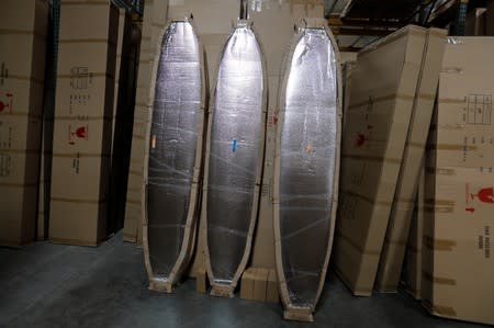 Doyle surfboards manufactured in China are shown in a warehouse in Lake Forest, California