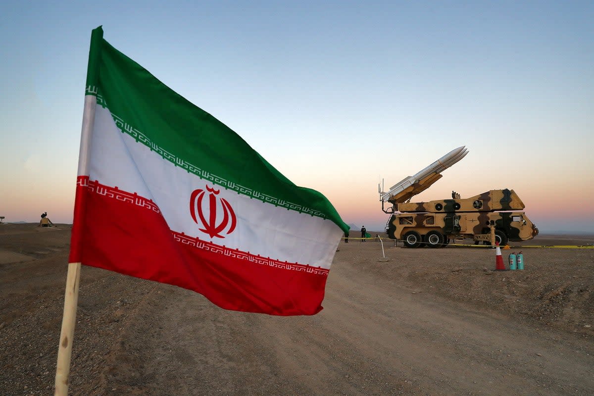 An Iranian flag is pictured near a missile during a military drill (File picture) (VIA REUTERS)