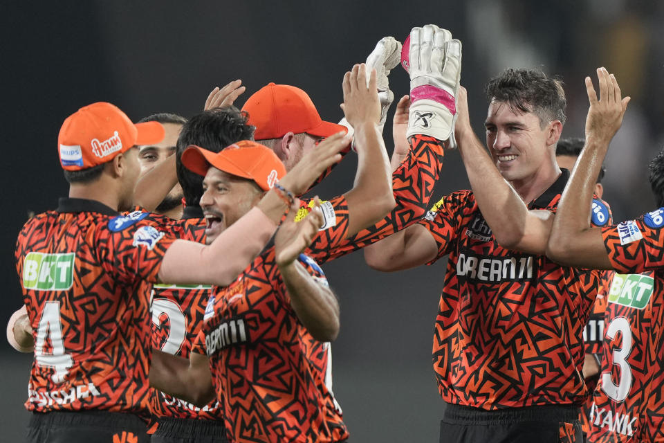 Sunrisers Hyderabad's captain Pat Cummins, right without cap, celebrates with teammates after the dismissal of Mumbai Indians' Rohit Sharma during the Indian Premier League cricket tournament between Sunrisers Hyderabad and Mumbai Indians in Hyderabad, India, Wednesday, March 27, 2024.(AP Photo/Mahesh Kumar A.)