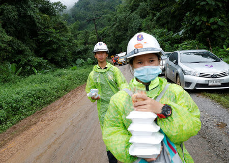 Rescue workers are seen near Tham Luang cave complex during a search for members of an under-16 soccer team and their coach, in the northern province of Chiang Rai, Thailand, June 28, 2018. REUTERS/Soe Zeya Tun