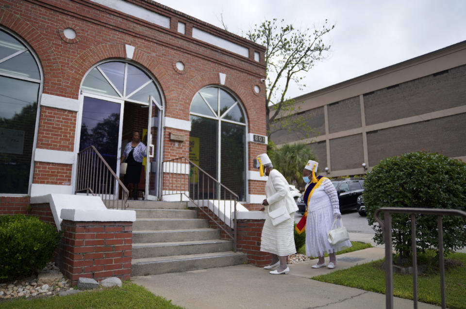 Members of the District 4 Eastern Stars are greeted at the door before attending Sunday service at Zion Baptist Church on April 16, 2023, in Columbia, S.C. (AP Photo/Jessie Wardarski)