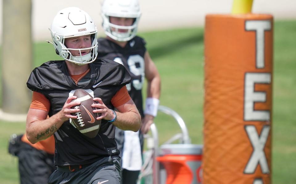 Texas quarterback Quinn Ewers drops back to pass during the first summer practice for the Longhorns at Denius Fields on Wednesday. Texas enters its first season in the SEC with high expectations after going 12-2 and reaching the College Football Playoff a year ago.