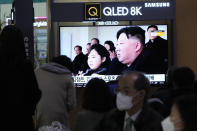 A TV screen shows a file image of North Korean leader Kim Jong Un, right, and his daughter, reportedly named Kim Ju Ae, during a news program at the Seoul Railway Station in Seoul, South Korea, Saturday, Feb. 18. 2023. South Korea's military said North Korea on Saturday fired one suspected long-range missile from its capital toward the sea, a day after it threatened to take strong measures against South Korea and the U.S. over their joint military exercises. (AP Photo/Ahn Young-joon)