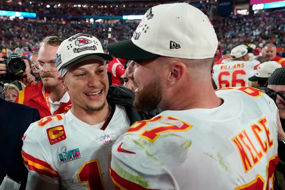 Kansas City Chiefs quarterback Patrick Mahomes, left, and tight end Travis Kelce celebrate victory over the Philadelphia Eagles after the NFL Super Bowl 57 football game, Sunday, Feb. 12, 2023, in Glendale, Ariz. The Kansas City Chiefs defeated the Philadelphia Eagles 38-35. (AP Photo/Ashley Landis)