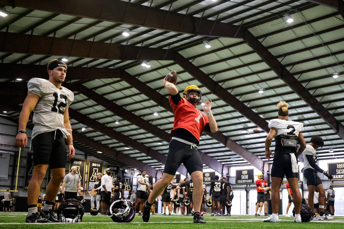 Appalachian State quarterback Chase Brice (7) warms up with teammates during practice in Boone, N.C., Tuesday, Aug. 30, 2022. The Appalachian State Mountaineers football team is preparing to host UNC this weekend.