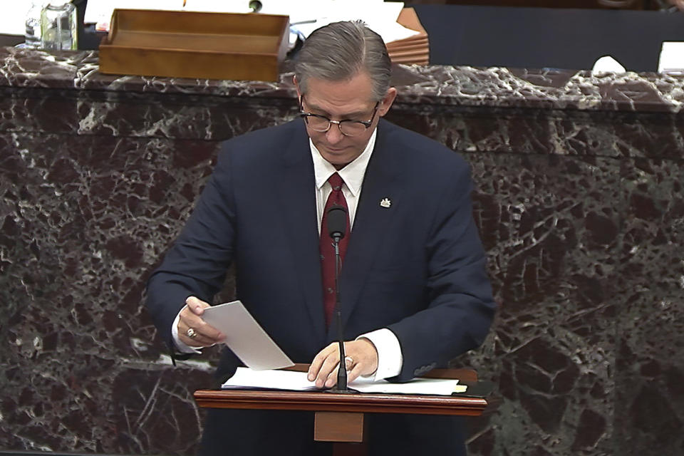 In this image from video, Bruce Castor, an attorney for former President Donald Trump, puts away a piece of paper he was handed as he speaks during the second impeachment trial of Trump in the Senate at the U.S. Capitol in Washington, Friday, Feb. 12, 2021. (Senate Television via AP)