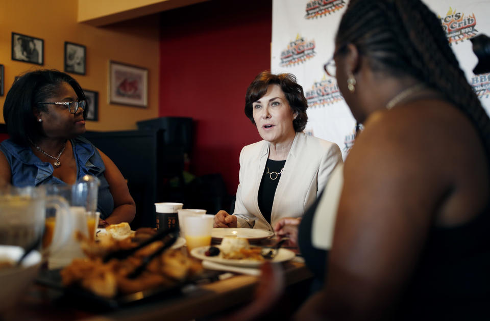 In this Sept. 29, 2018, photo, Rep. Jacky Rosen, D-Nev., center, speaks during a breakfast event at TC's Rib Crib as she campaigns in Las Vegas. In the high-stakes race for Senate in Nevada, Rosen is taking on one of the biggest names in GOP politics by painting Sen. Dean Heller as someone without firm principles. (AP Photo/John Locher)