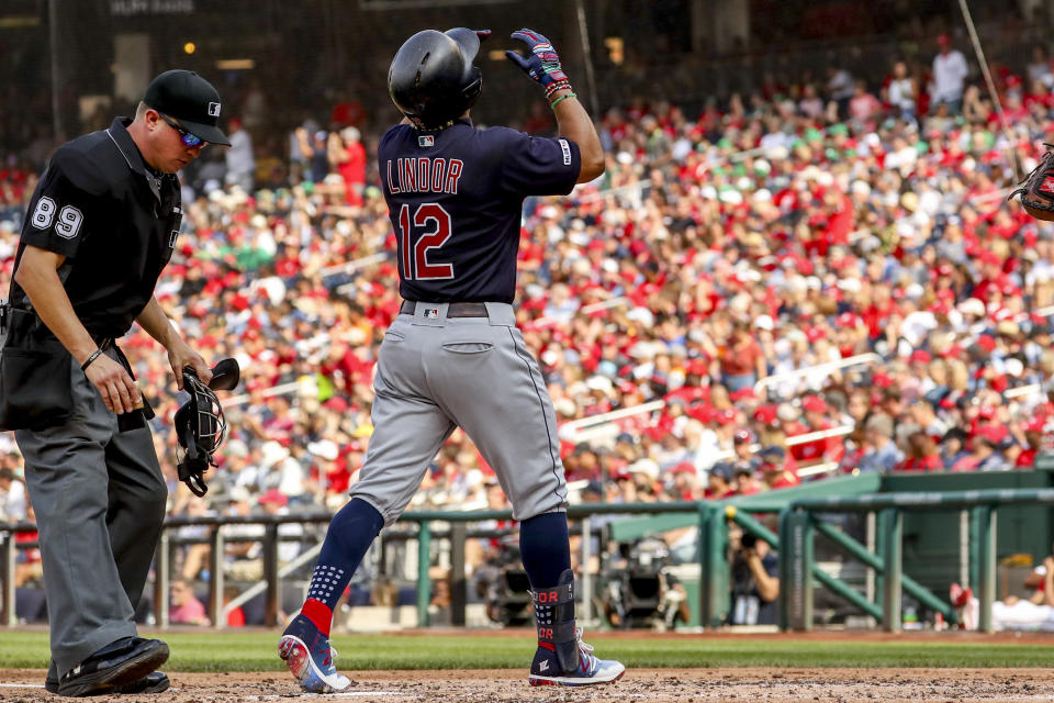Cleveland Indians Francisco Lindor (12) scores on a solo home run during the third inning of a baseball game against the Washington Nationals at Nationals Park, Sunday, Sept. 29, 2019, in Washington. (AP Photo/Andrew Harnik)