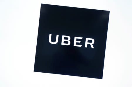 Uber's logo is pictured at its office in Tokyo, Japan, November 27, 2017.   REUTERS/Kim Kyung-Hoon