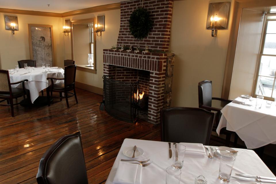 The fireplace adds a cozy ambience to DeWolf Tavern at Bristol Harbor Inn/