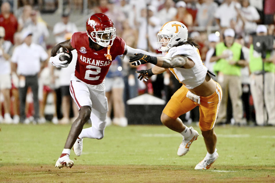 Arkansas wide receiver Andrew Armstrong (2) tries to get past Tennessee linebacker Keenan Pili (11) during the first half of an NCAA college football game on Saturday, Oct. 5, 2024, in Fayetteville, Arkansas. (AP Photo/Michael Woods)