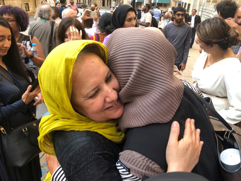 Shamim Syed, Adnan Syed's mother, left, celebrates with others outside the Cummings Courthouse, Monday, Sept. 19, 2022, in Baltimore. A judge has ordered the release of Adnan Syed after overturning his conviction for a 1999 murder that was chronicled in the hit podcast â€œSerial.â€ (AP Photo/Brian Witte)