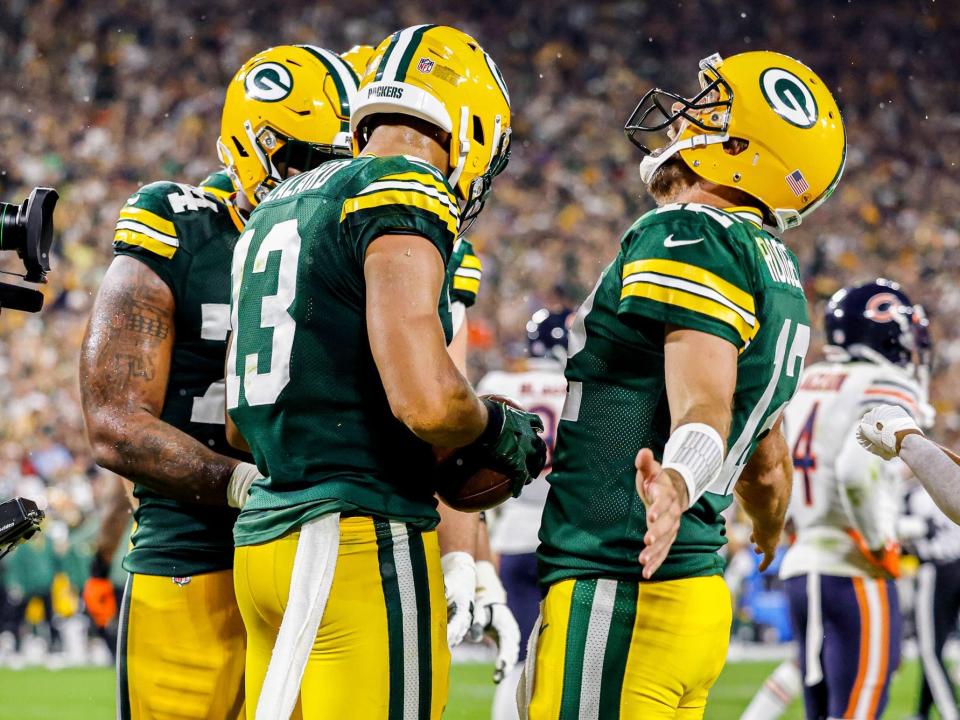 Aaron Rodgers and Allen Lazard celebrate a touchdown against the Chicago Bears.