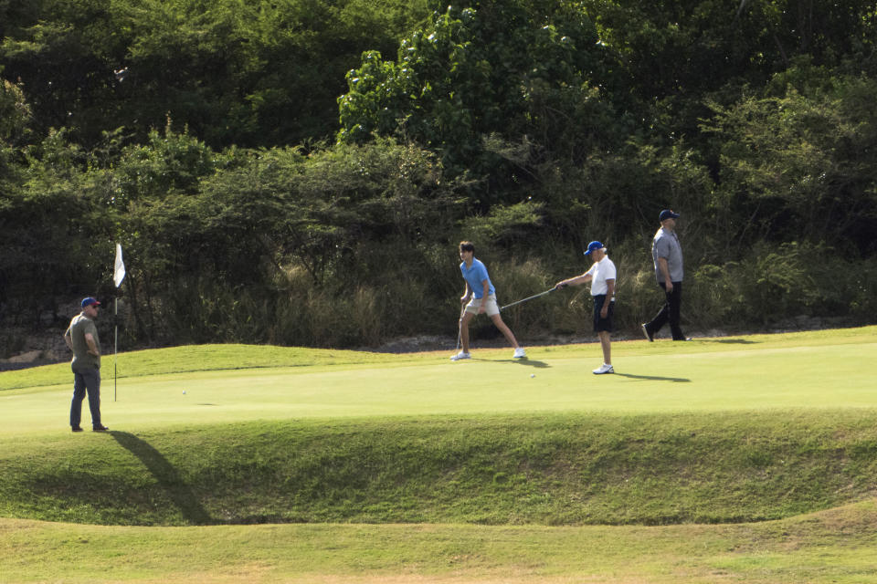 President Joe Biden plays golf with grandson Hunter Biden, second from left, at The Buccaneer in Christiansted, U.S. Virgin Islands, Friday, Dec. 30, 2022. (AP Photo/Manuel Balce Ceneta)