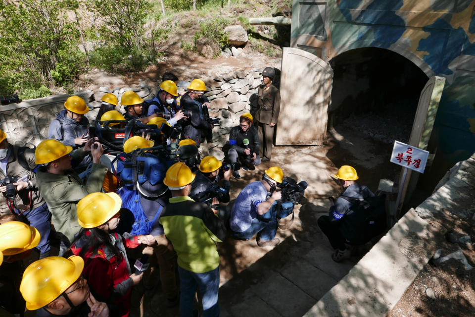 Foreign media crowd the entrance of the north tunnel at North Korea's   Punggye-ri nuclear test site during a visit to see its purported demolition on May 24, 2018, in North Hamgyong Province, North Korea. / Credit: APTN via AP