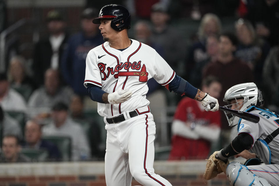 Atlanta Braves shortstop Vaughn Grissom watches his RBI single next to Miami Marlins catcher Jacob Stallings during the eighth inning of a baseball game Wednesday, April 26, 2023, in Atlanta. (AP Photo/John Bazemore)