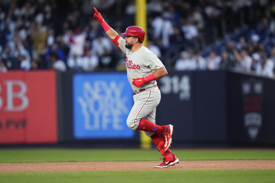 Philadelphia Phillies' Kyle Schwarber gestures to fans as he runs the bases after hitting a home run against the New York Yankees during the first inning of a baseball game Tuesday, April 4, 2023, in New York. (AP Photo/Frank Franklin II)