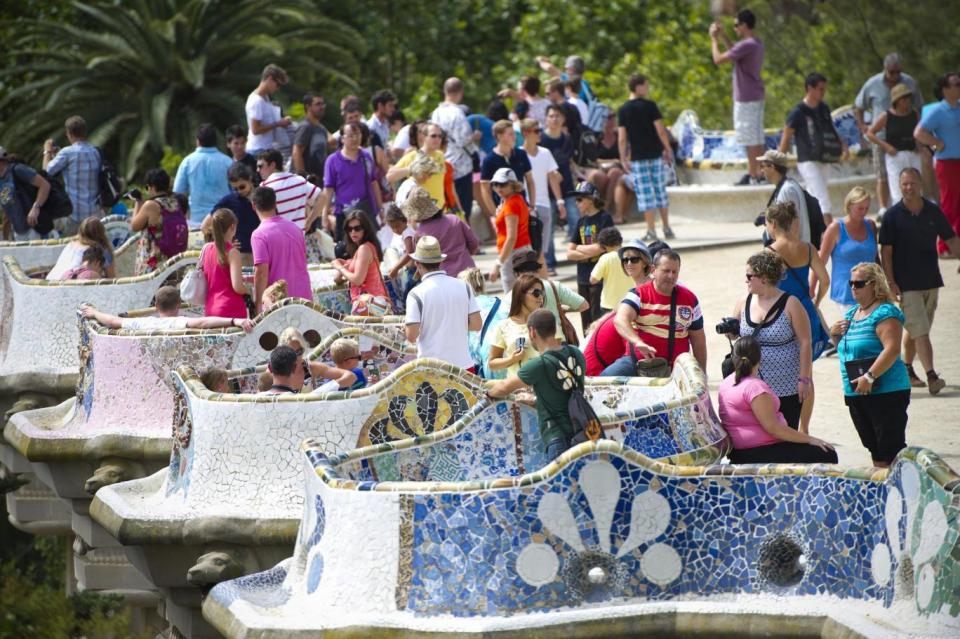 Park Güell may never have seen its intended residents, but nine million tourists visit every year (Getty)