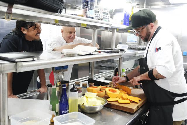 <p>David Moir/Bravo</p> Ed Lee and Tom Colicchio check in on Dan Jacobs during the 'Top Chef; Wisconsin' semifinals elimination challenge