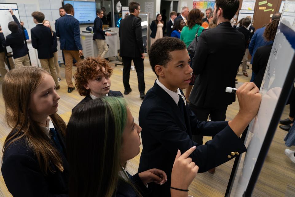 Middle school students taking the TCALC college prep course work on math problems Tuesday afternoon while U.S. secreatary of ecuation Miguel Cardona and Kansas officials tour the building.