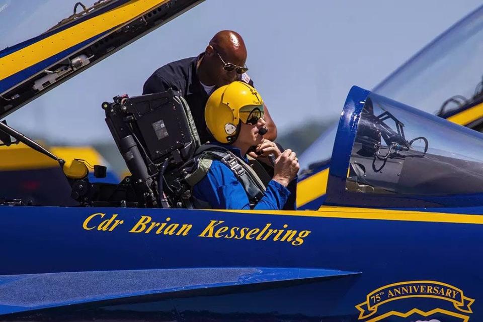 Petty Officer 1st Class Kevin Hill works with Cmdr. Brian Kesselring, a Blue Angels pilot and the squadron's commanding officer during Hill's 2019-22 tenure with the demonstration squadron.