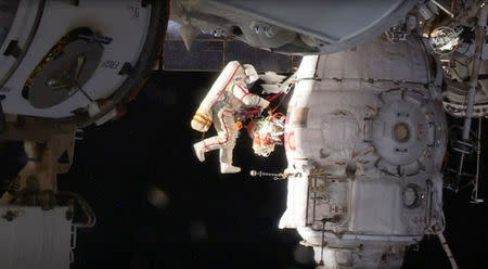 Russian cosmonaut Oleg Kononenko conducts a spacewalk outside the International Space Station Space (ISS) in this still image captured from NASA video in space, December 11, 2018. Courtesy NASA TV/Handout via REUTERS