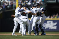 Seattle Mariners celebrate a 5-1 win over the Cincinnati Reds in a baseball game Wednesday, April 17, 2024, in Seattle. (AP Photo/John Froschauer)