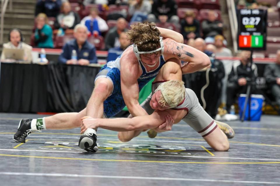 Central Mountain’s Luke Simcox and State College’s Pierson Manville face off in the 145-pound PIAA Class 3A finals match on Saturday, March 9, 2024 at the Giant Center in Hershey.