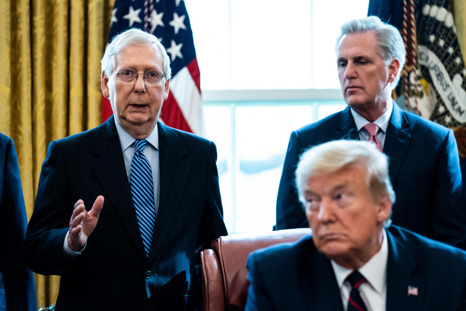WASHINGTON, DC - MARCH 27: (L-R) Senate Majority Leader Mitch McConnell (R-KY) speaks as House Minority Leader Kevin McCarthy (R-CA) U.S. President Donald Trump listen during a signing ceremony for H.R. 748, the CARES Act in the Oval Office of the White House on March 27, 2020 in Washington, DC. Earlier on Friday, the U.S. House of Representatives approved the $2 trillion stimulus bill that lawmakers hope will battle the the economic effects of the COVID-19 pandemic. (Photo by Erin Schaff-Pool/Getty Images)