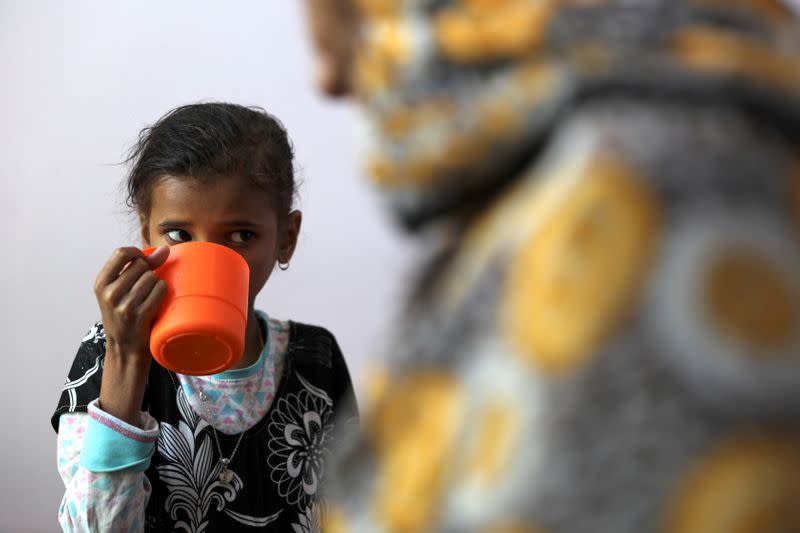 Ahmadiya Juaidi, 13, drinks a supplemental nutrition shake at malnutrition treatment ward of al-Sabeen hospital in Sanaa