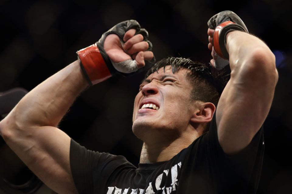 SINGAPORE - JANUARY 04: Royston Wee reacts after defeating Dave Galera during their UFC Fight Night Singapore bantamweight bout at Marina Bay Sands on January 4, 2014 in Singapore. (Photo by Suhaimi Abdullah/Getty Images)