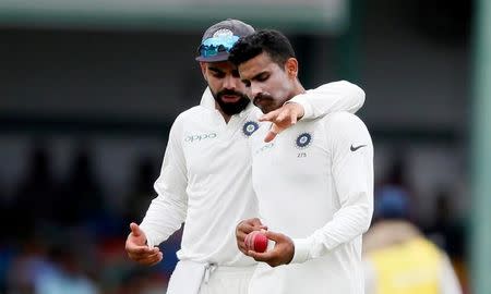 Cricket - Sri Lanka v India - Second Test Match - Colombo, Sri Lanka - August 6, 2017 - India's captain Virat Kohli and Ravindra Jadeja discuss a point. REUTERS/Dinuka Liyanawatte