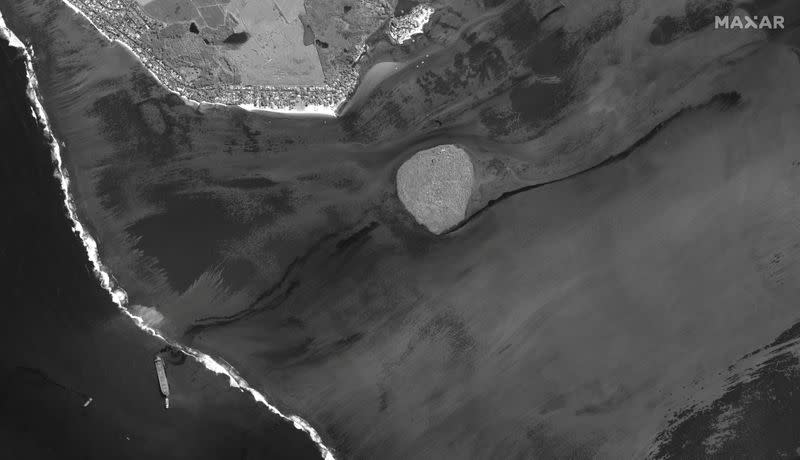 A satellite image shows the MV Wakashio ship and the oil spill off the southeast coast of Mauritius