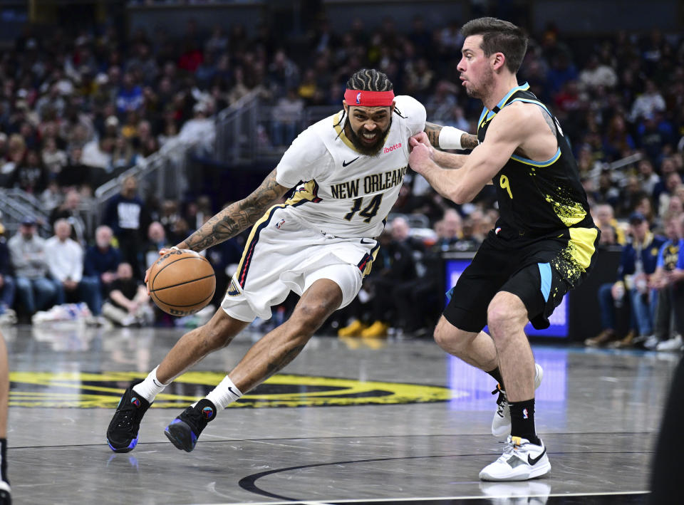 New Orleans Pelicans forward Brandon Ingram (14) drives against Indiana Pacers guard T.J. McConnell (9) during the second half of an NBA basketball game Wednesday, Feb. 28, 2024, in Indianapolis. (AP Photo/Marc Lebryk)